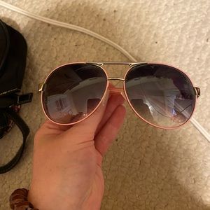 aviator shaped sunglasses with pink and silver frame